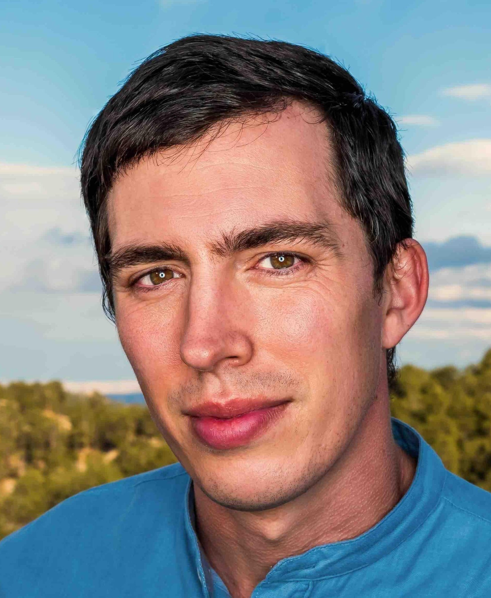 Grant Wilson, Executive Director of Earth Law Center, standing confidently in a professional setting, advocating for environmental justice and nature’s rights