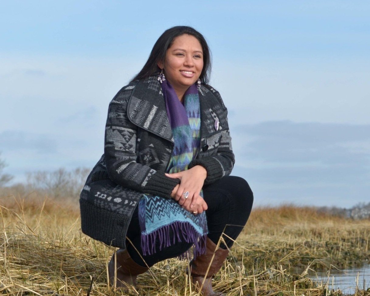 "Kelsey Leonard, Expert in Indigenous Ocean Rights, In natural surroundings, Smiling.