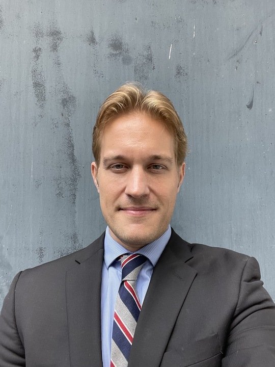 "Kevin Schneider, lecturer at Earth Law Center, with the legal and ethical question 'Is an Elephant a Person?' in his discussion on animal rights and personhood.